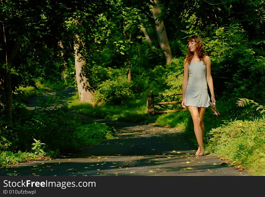 Pretty girl on forested pathway. Pretty girl on forested pathway.