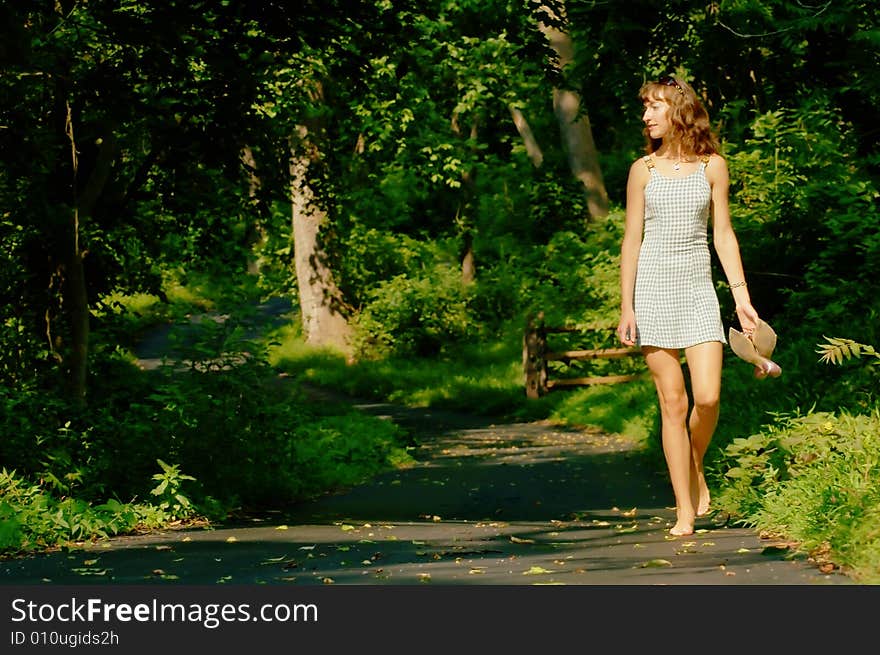 Pretty girl on forested pathway. Pretty girl on forested pathway.