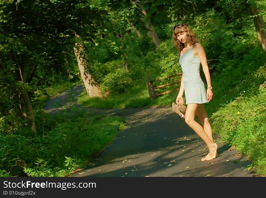 Pretty girl on forest path