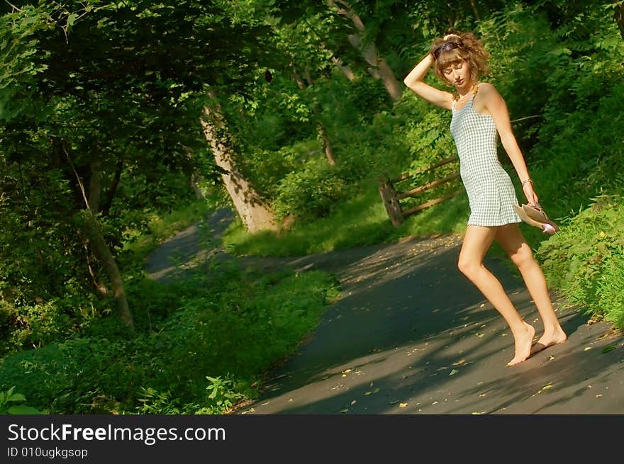 Pretty girl on forested pathway. Pretty girl on forested pathway.