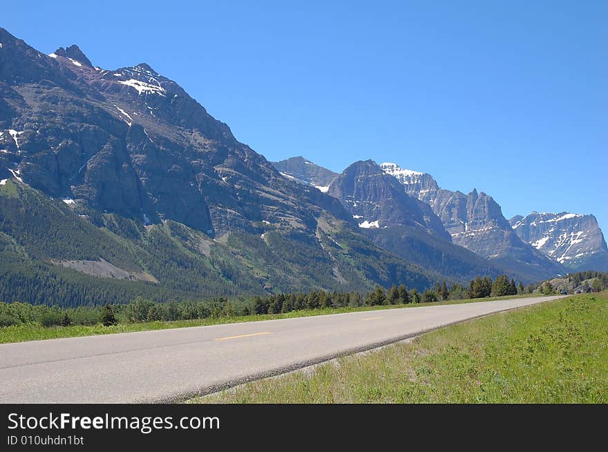 The 8-km scenic drive to the entrance of waterton lake national park, alberta, canada. The 8-km scenic drive to the entrance of waterton lake national park, alberta, canada