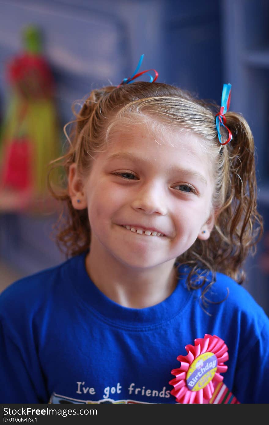 Little girl with curls has a new hairstyle complete with bows. Little girl with curls has a new hairstyle complete with bows