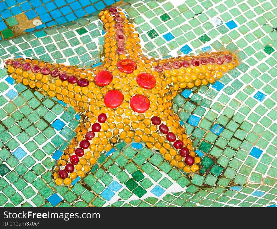 A starfish design on the floor of a fountain. A starfish design on the floor of a fountain