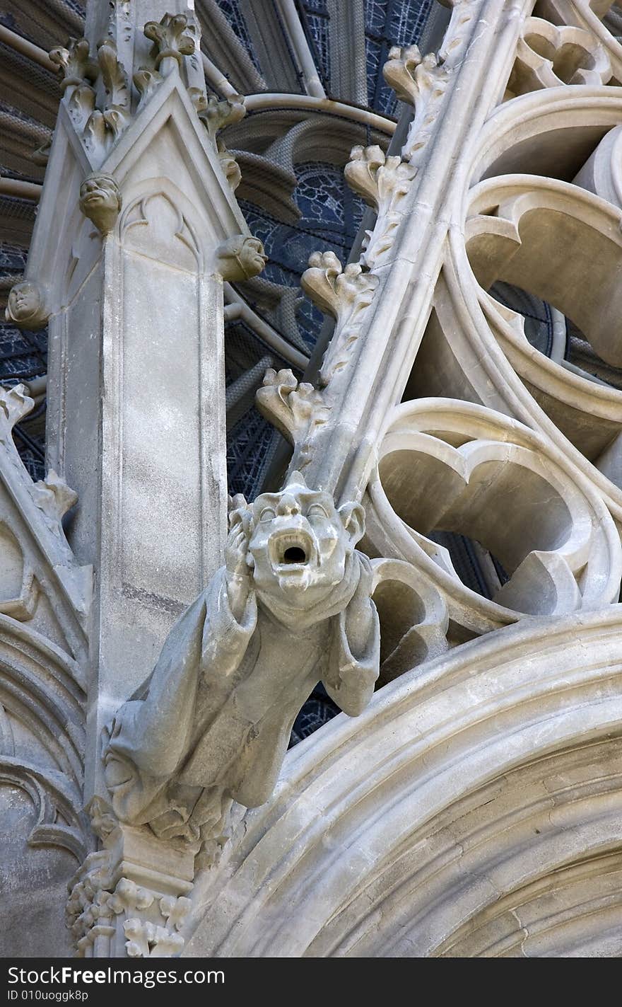 A gargoyle with an ugly human face on the exterior of St. Nazaire, Carcassonne. A gargoyle with an ugly human face on the exterior of St. Nazaire, Carcassonne.