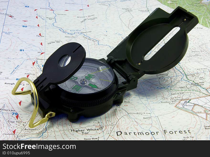 Close up view on a military compass on a map. Close up view on a military compass on a map