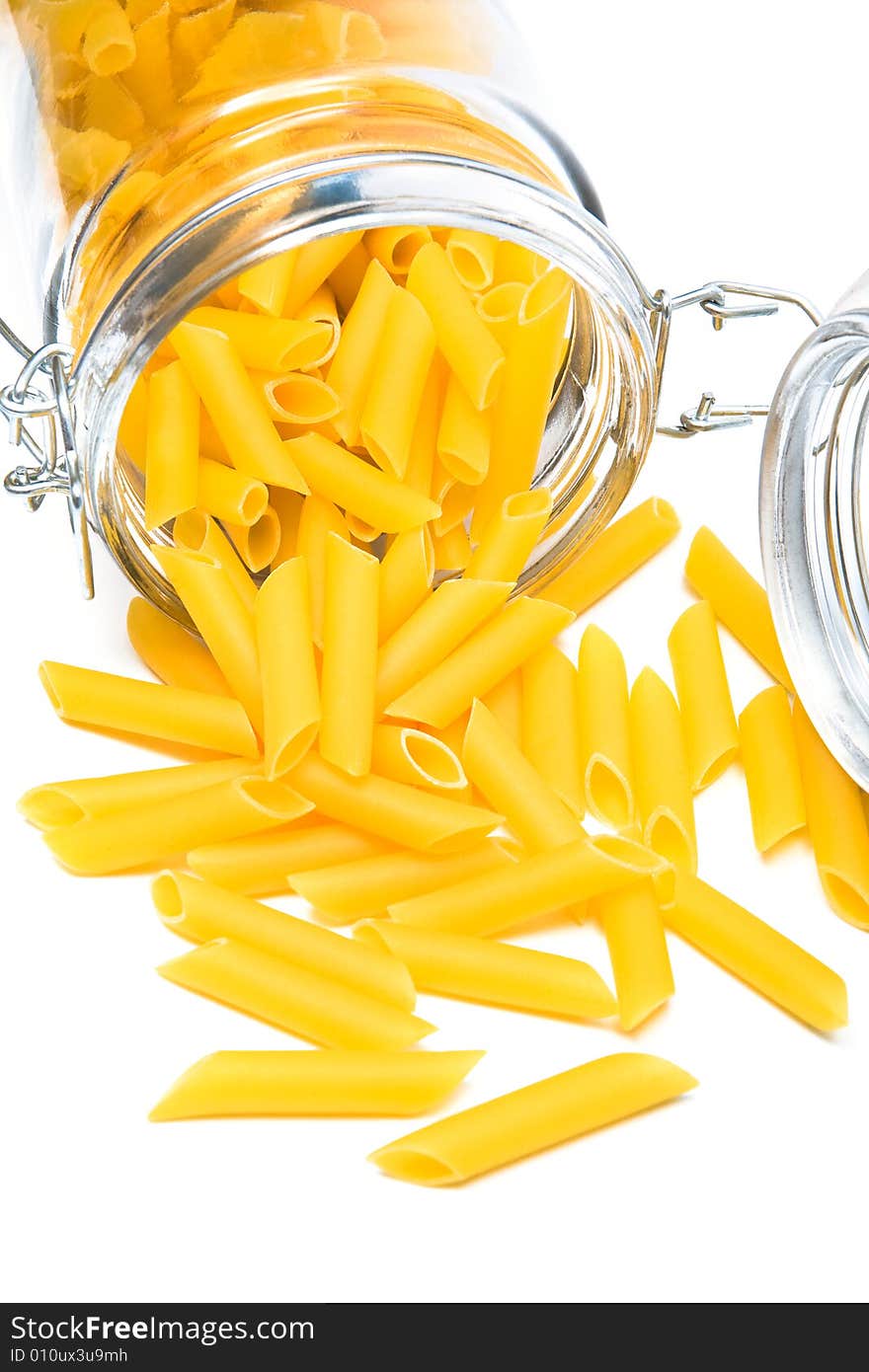 Pasta in glass can on a white background