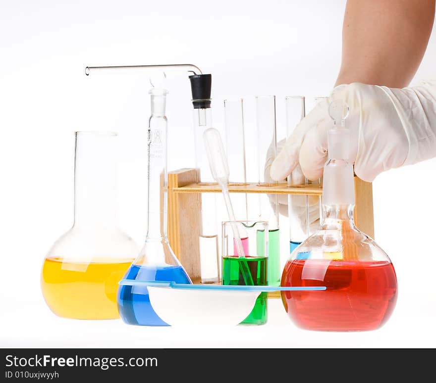 Various colorful glass laboratory ware on a white background. Various colorful glass laboratory ware on a white background