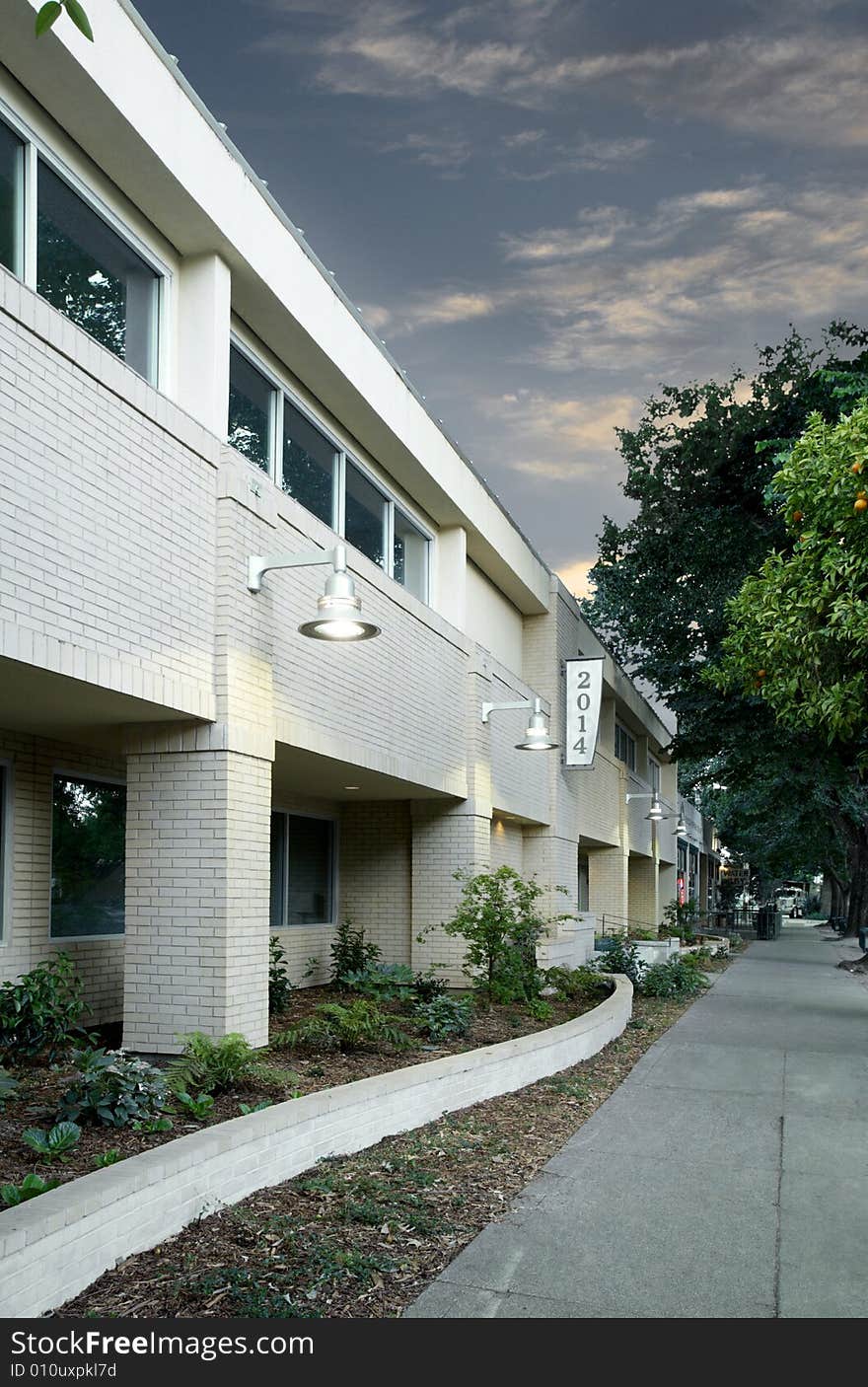 An office building with a empty parking lot