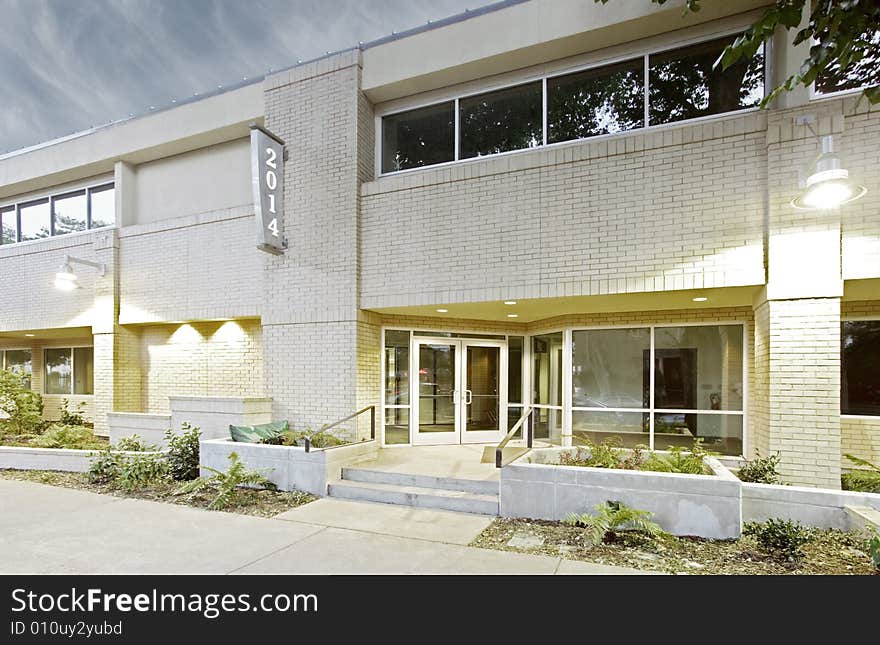 An office building with a empty parking lot