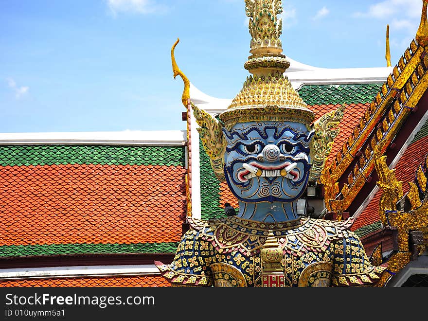 Thailand Bangkok; the wat Phra Kaew shelter the most sacred image of Thailand the Emerald Buddha. The temple is situated in the northeast corner of the Grand Palace. View of a blue giant or yakshas. Thailand Bangkok; the wat Phra Kaew shelter the most sacred image of Thailand the Emerald Buddha. The temple is situated in the northeast corner of the Grand Palace. View of a blue giant or yakshas