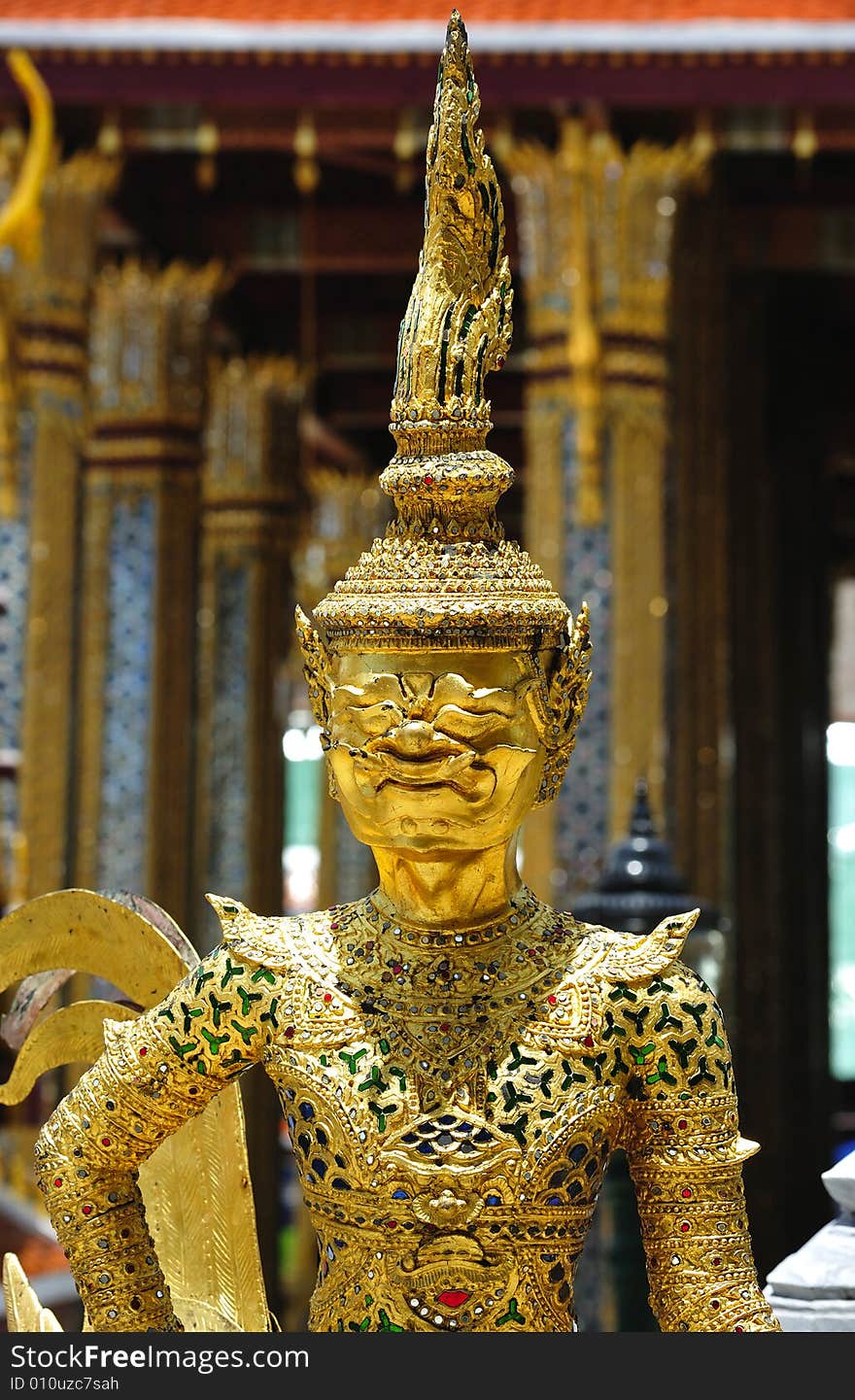 Thailand Bangkok; the wat Phra Kaew shelter the most sacred image of Thailand the Emerald Buddha. The temple is situated in the northeast corner of the Grand Palace. View of a mtyhological being. Thailand Bangkok; the wat Phra Kaew shelter the most sacred image of Thailand the Emerald Buddha. The temple is situated in the northeast corner of the Grand Palace. View of a mtyhological being