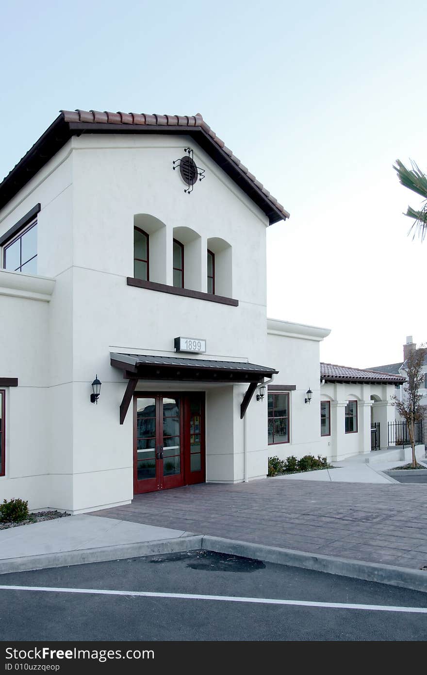 An office building with a empty parking lot