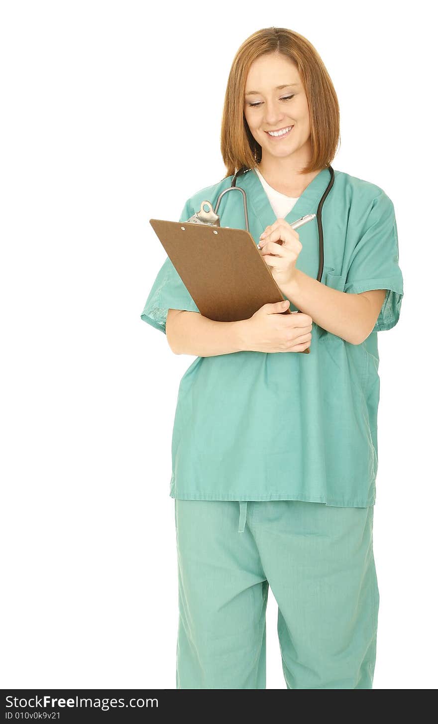 Shot of isolated on white of woman in medical uniform smiling and looking at her report on clip board. Shot of isolated on white of woman in medical uniform smiling and looking at her report on clip board