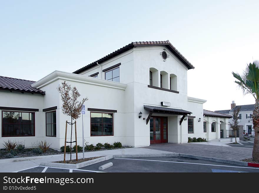 An office building with a empty parking lot