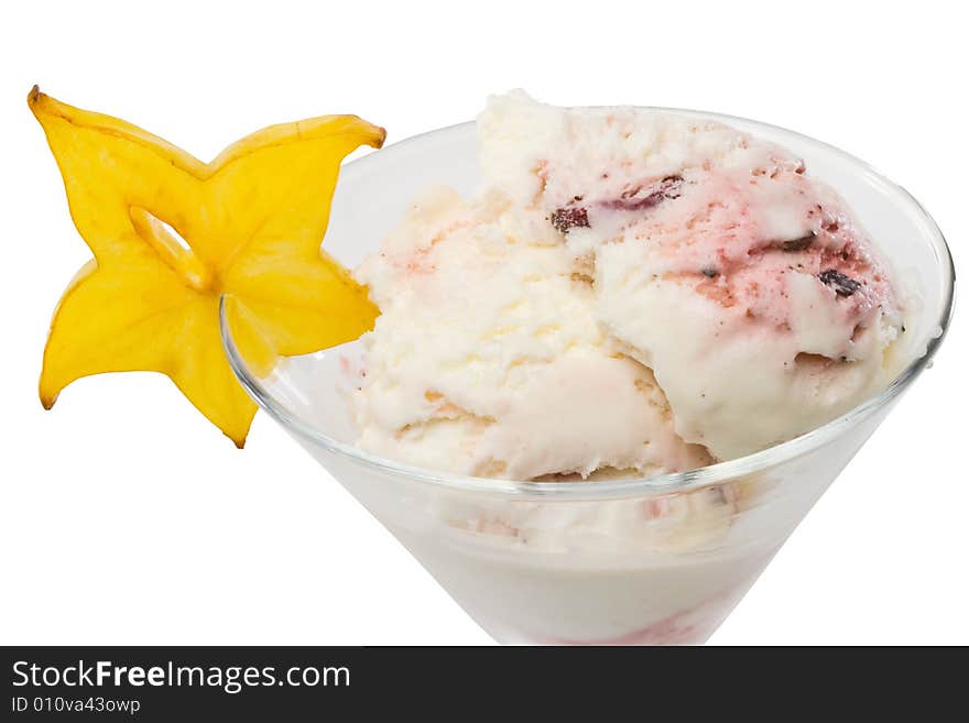 Ice-cream with slice of carambola in a glass on a white background. Ice-cream with slice of carambola in a glass on a white background.