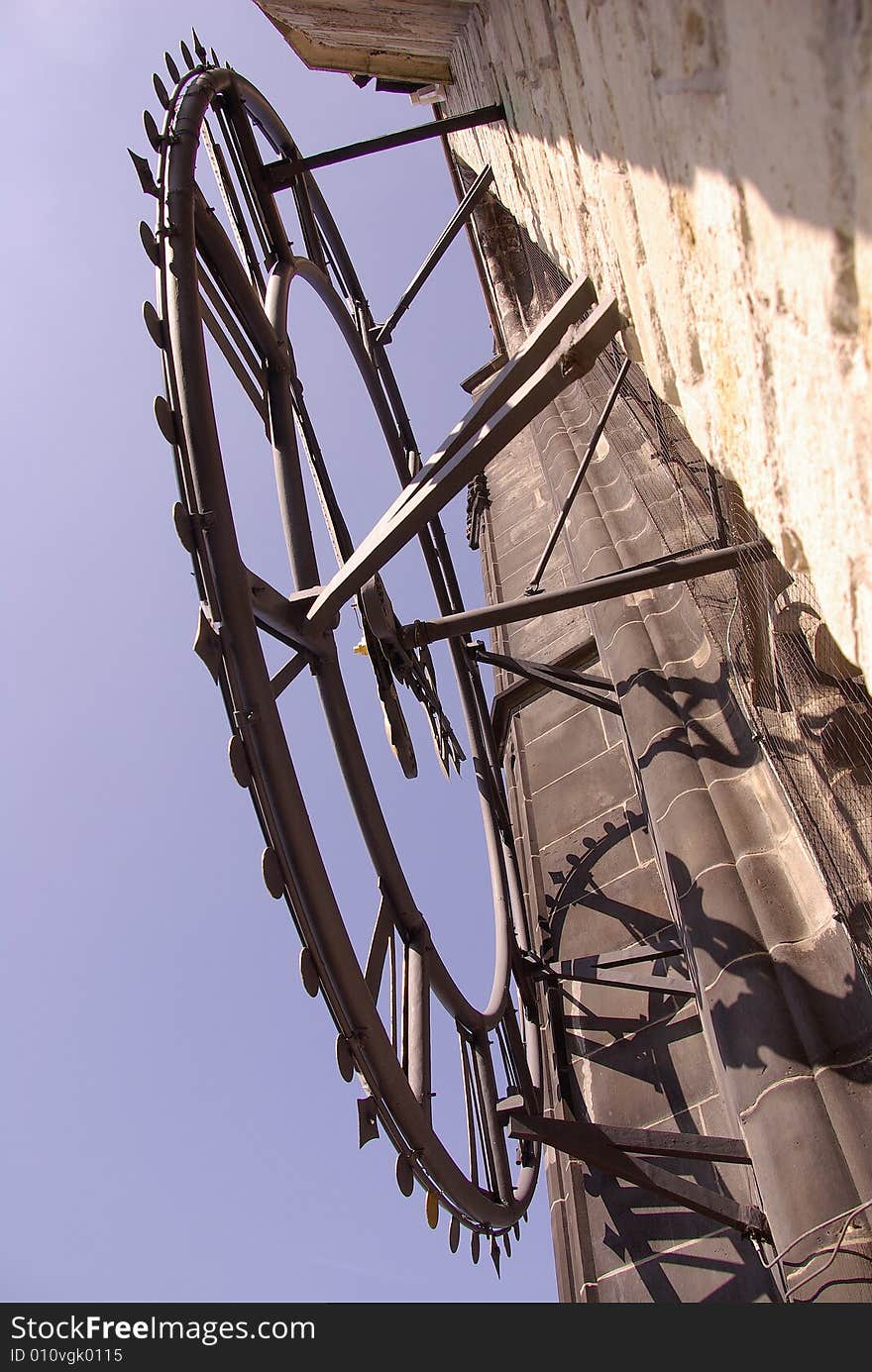 A close-up of a clock at a church tower