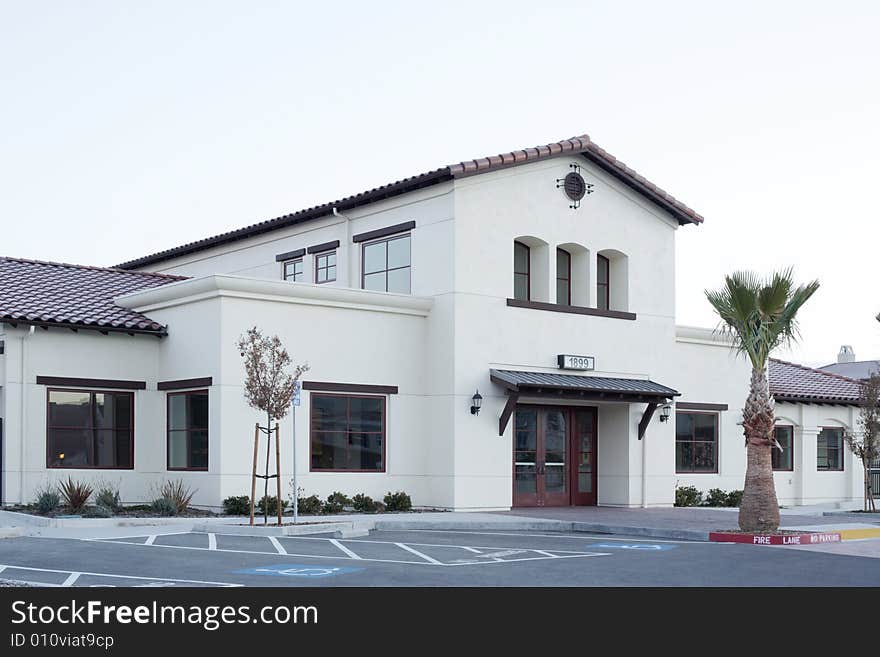 An office building with a empty parking lot