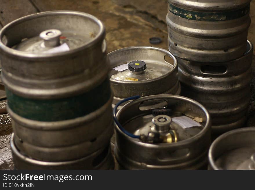 Tin barrels are filled by beer