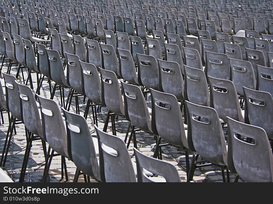 Rows of empty grey chairs