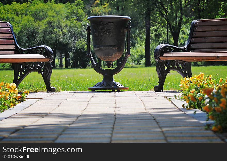 Big metal urn in the park.