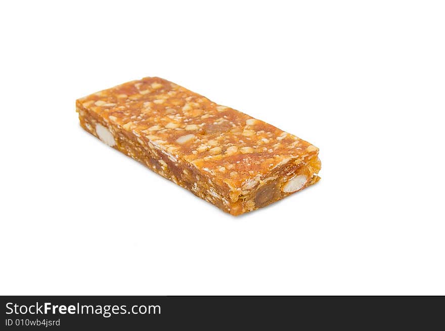 Pressed fruit stick with nuts and raisin