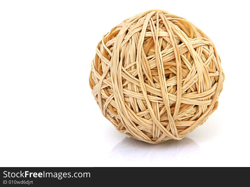 Ball made of rubber bands isolated on white background with small reflection. Ball made of rubber bands isolated on white background with small reflection