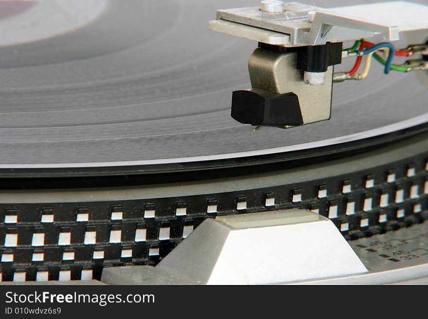 Closeup of old turntable with long play vinyl. Closeup of old turntable with long play vinyl