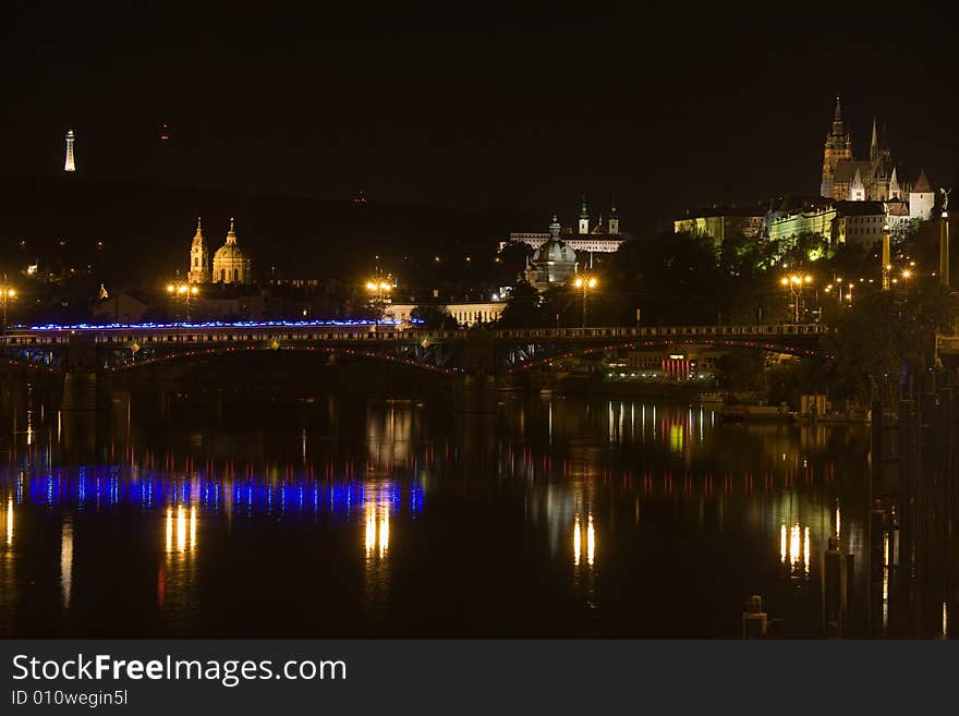 Panoramic night view to Lesser Town, Prague castle, St. Nicholas church and Petrin Tower. Panoramic night view to Lesser Town, Prague castle, St. Nicholas church and Petrin Tower.