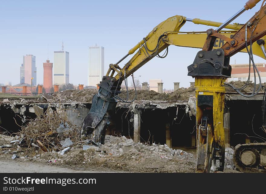 Diggers destroying building for new city. Diggers destroying building for new city