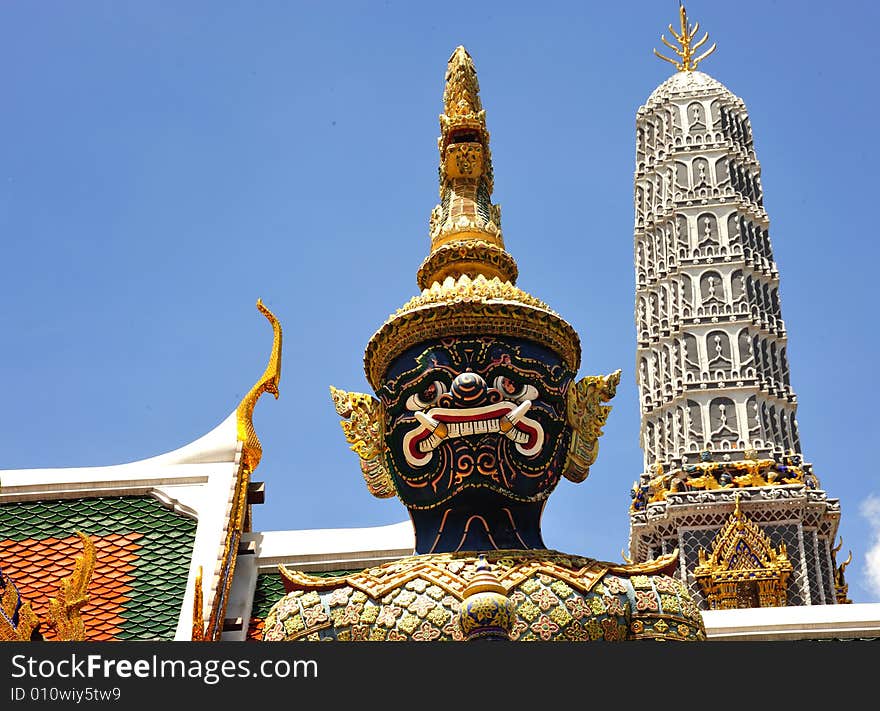 Thailand Bangkok; the wat Phra Kaew shelter the most sacred image of Thailand the Emerald Buddha. The temple is situated in the northeast corner of the Grand Palace. View of a giant or yakshas. Thailand Bangkok; the wat Phra Kaew shelter the most sacred image of Thailand the Emerald Buddha. The temple is situated in the northeast corner of the Grand Palace. View of a giant or yakshas