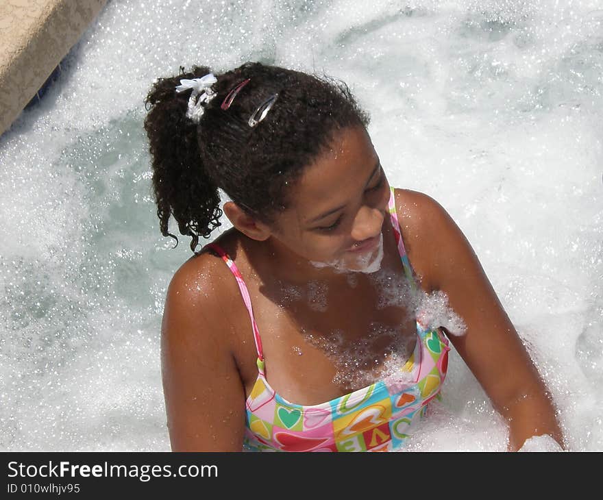 A picture of a young girl in a jacuzzi. A picture of a young girl in a jacuzzi.