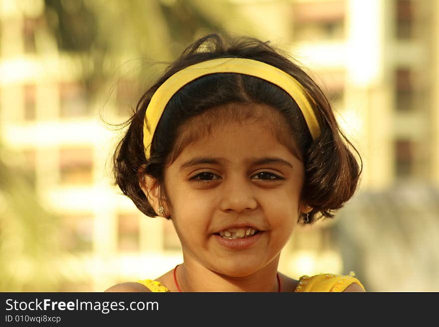 The lovely and warm face of a small girl. The lovely and warm face of a small girl.