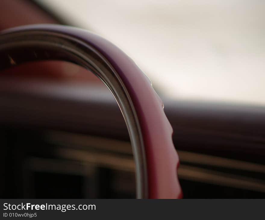 A steering wheel of a collector's car. A steering wheel of a collector's car