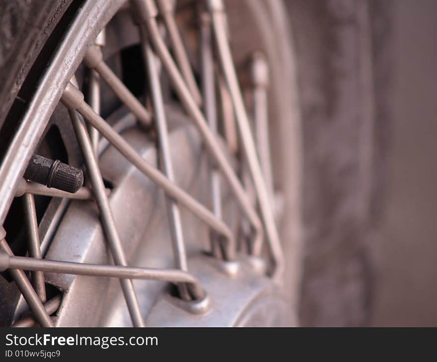 The hubcap of a vintage collector car. The hubcap of a vintage collector car