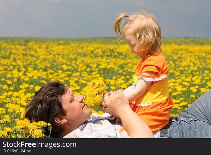 Father and daughter on meadow. Father and daughter on meadow