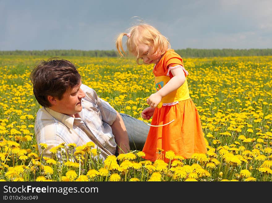 Father and daughter on meadow. Father and daughter on meadow