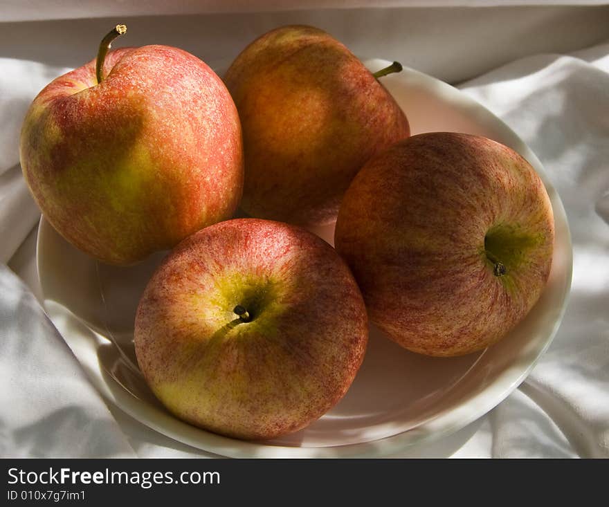 A bowl of crunchy red apples. A bowl of crunchy red apples.