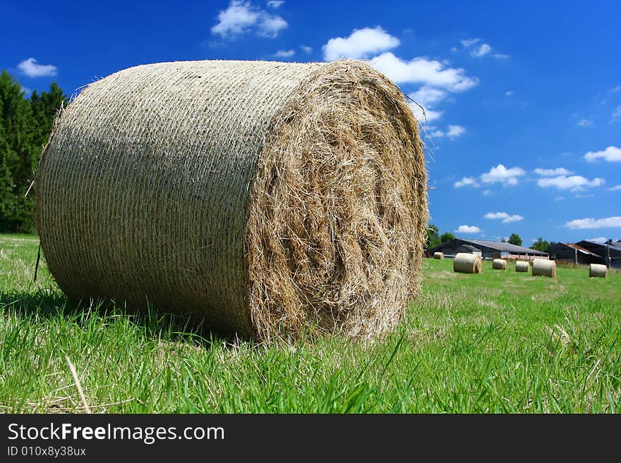 Sumer image: hay bales near a farm