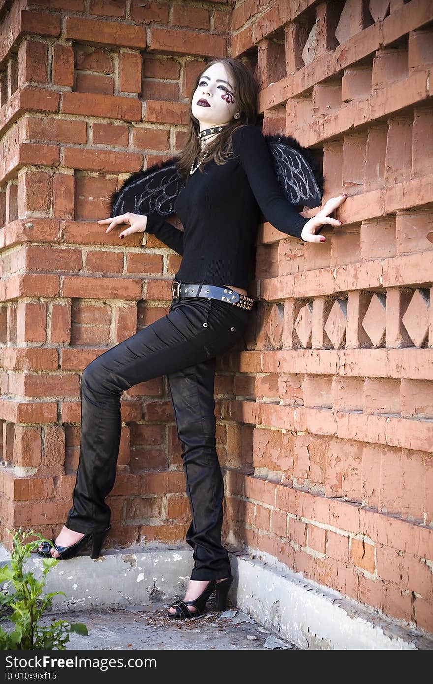 Gothic Angel Against Brick Wall