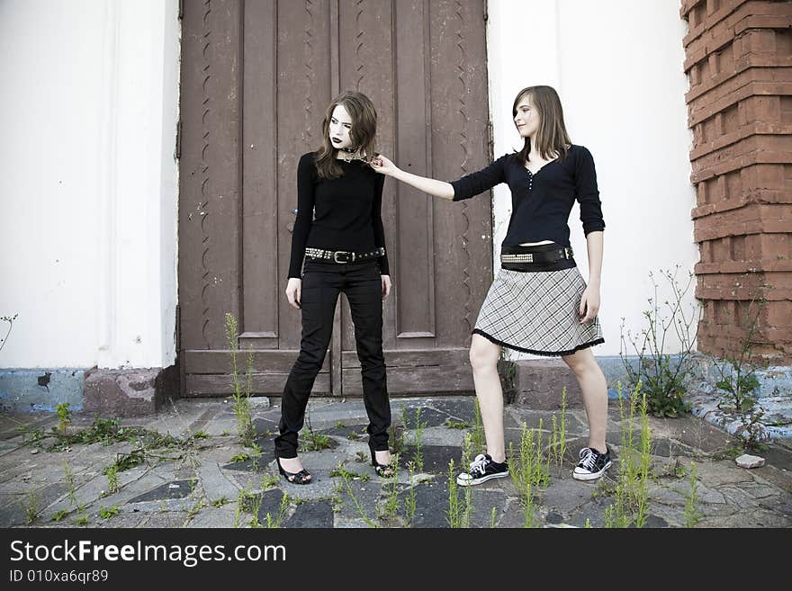 Teen Games. Two Teenager Girls Against Old Building.