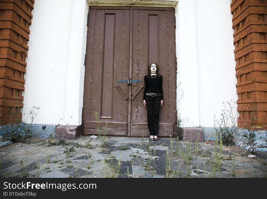 Gothic Style Girl Near A Door