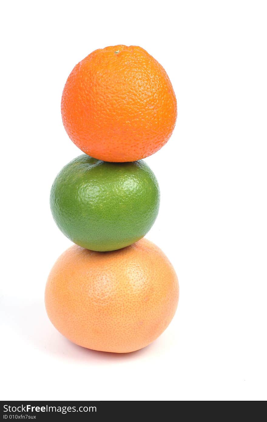 Citrus pyramid made of orange, grapefruit and sweety isolated on white background