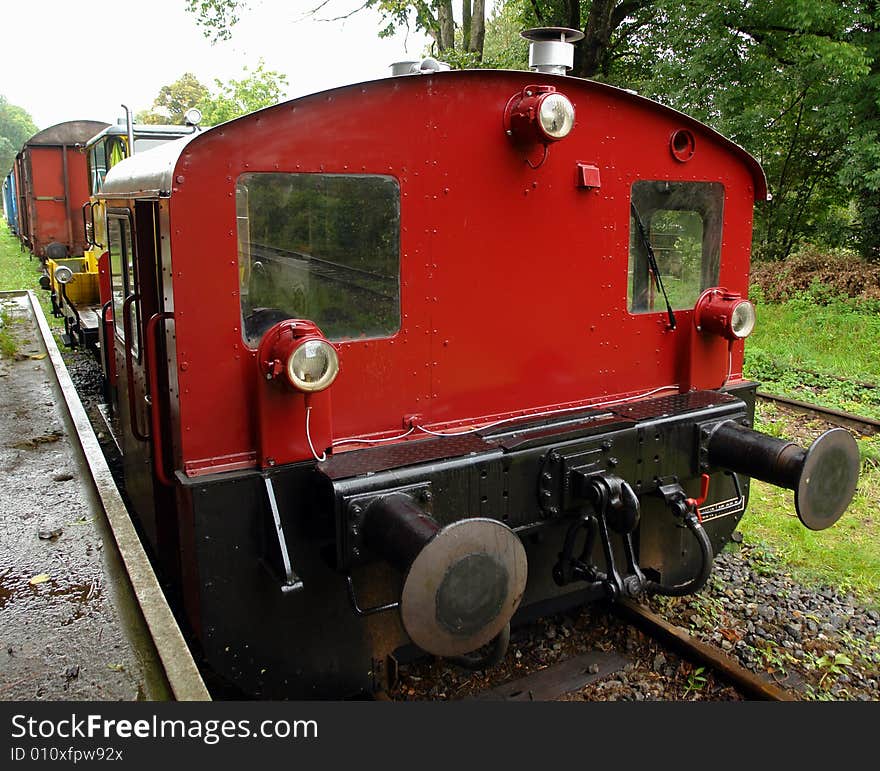 The old red locomotive on a platform at small railway station Amerang in Bavaria.