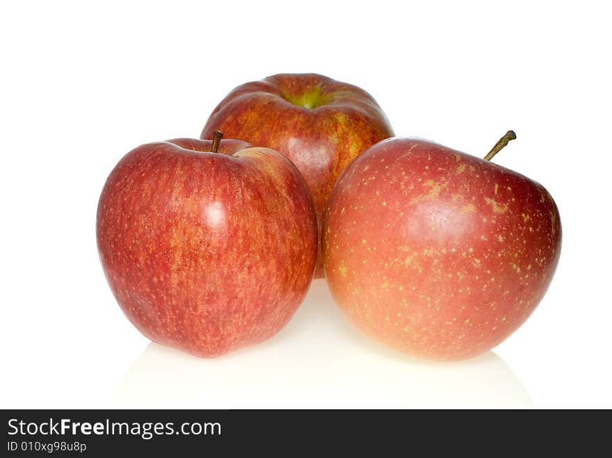 Three red apples of different breeds isolated on the white background