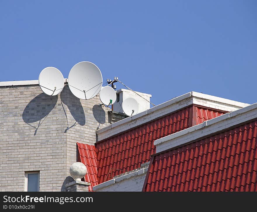 Satellite aerials on a roof of the house