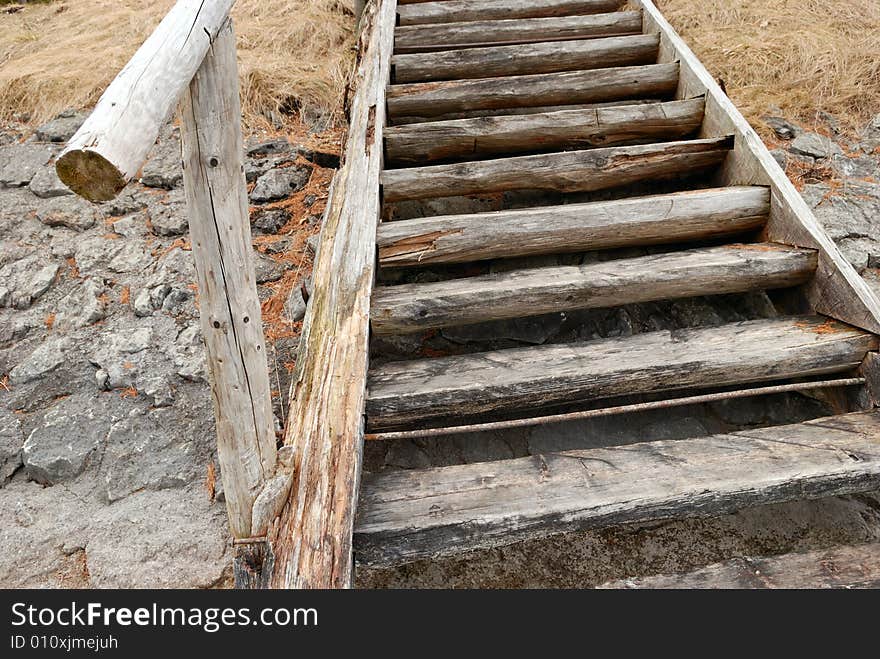 Old wooden stairs on the lake bank