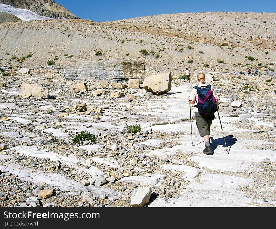 A woman walking in the Rocky Mountains, Canada. A woman walking in the Rocky Mountains, Canada.