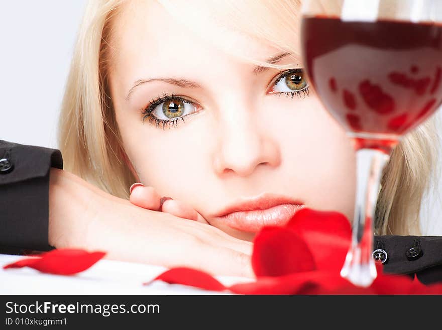 Cute blonde with wine and petals. Cute blonde with wine and petals