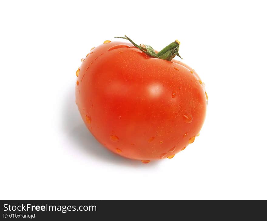 Single fresh red tomato with water drops and isolated on white background. Single fresh red tomato with water drops and isolated on white background