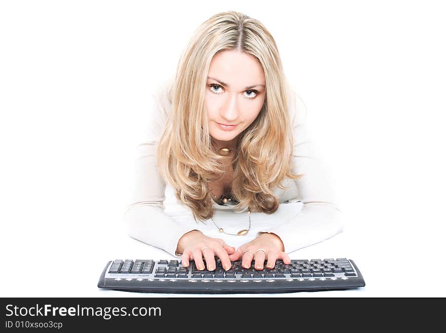 Portrait of a cute blonde with keyboard isolated on white